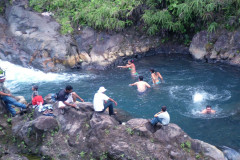 Swimming on Rio Penjamo on tour at Blue River Resort & Hot Springs, Costa Rica