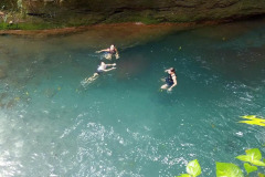 Swimming in Rio Azul, a blue river at Blue River Resort & Hot Springs, Costa Rica.