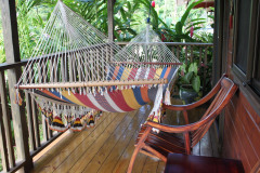 Room balcony with hammock and chairs